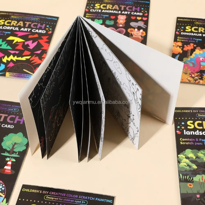 Open scratch art book with colorful designs on a beige surface, surrounded by closed books.