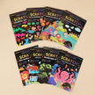 Collection of Scratch art books with colorful designs on a beige background
