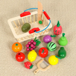 Colorful toy fruits, vegetables, and a basket on a beige surface