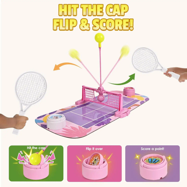 Children's toy tennis set with rackets and ball on a pink court, featuring text 'Hit the Cap, Flip & Score!'.