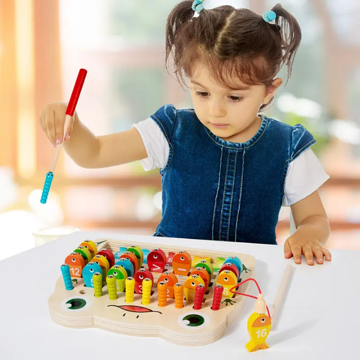 Child playing with a colorful wooden toy on a table.
