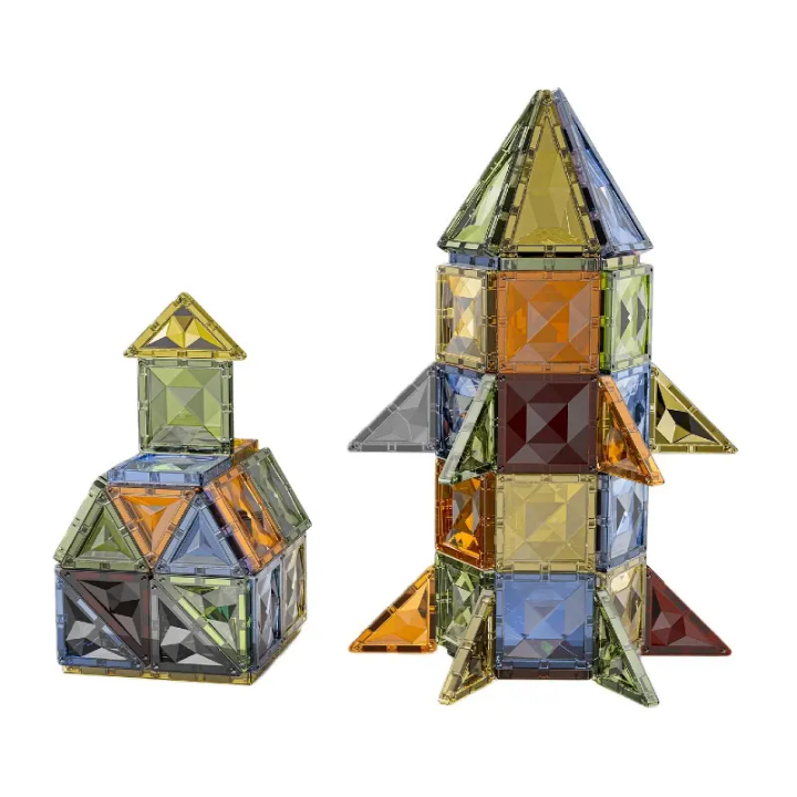 84-piece 3D diamond-cut magnetic tiles building blocks set with triangular and square pieces forming a rocket and castle for STEM play