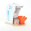 Children's toy coffee set with a white coffee machine, orange cup, and wooden tray on a white background.