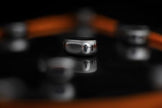 Close-up of a metallic ring with blurred background