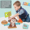 Child playing with a educational toy featuring monkeys and numbers