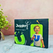 Juggling product packaging with a child holding a juggling ball on a marble surface.