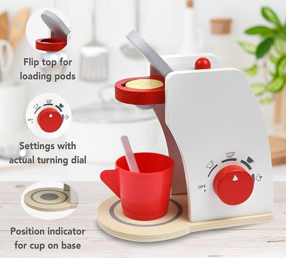 Children's toy espresso machine with red accents on a light wooden surface.