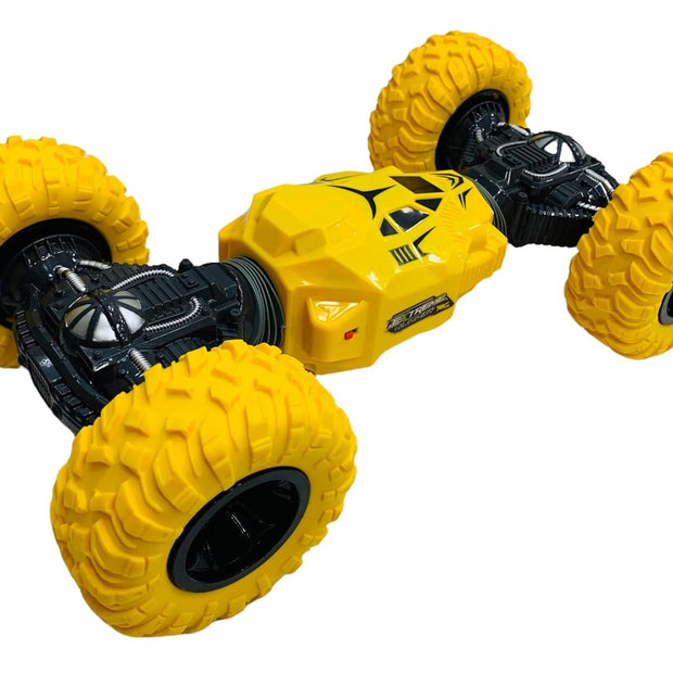 Yellow 2-sided stunt RC monster truck with oversized durable off-road tyres, 4WD chassis and 2.4GHz remote control for kids