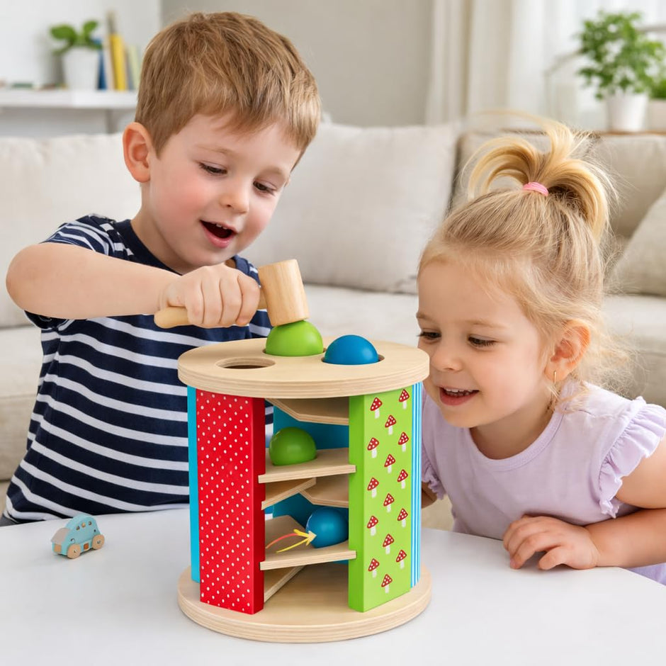 Two children playing with a colorful wooden toy in a living room.