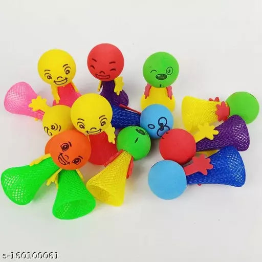 Colorful plastic toys with various shapes and faces on a white background